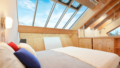 2. Obergeschoß - Schlafzimmer mit Dachverglasung und Seeblick